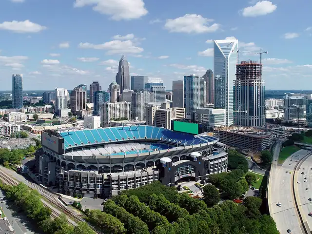 Uptown Charlotte skyline and stadium from above. Flights from Charlotte to Las Vegas