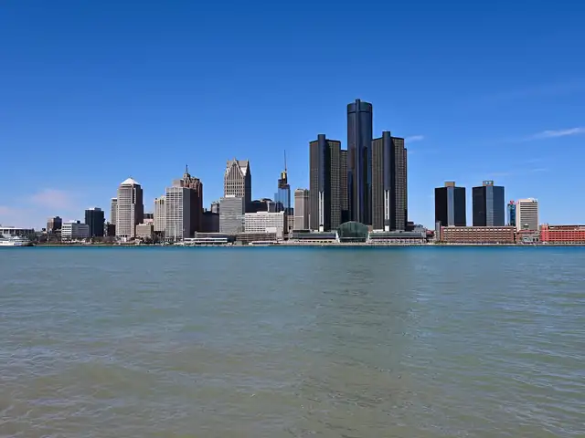 Detroit skyline across the Detroit River. Flights from Denver to Detroit
