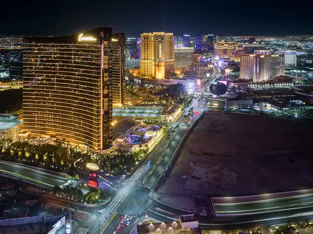 Las Vegas Strip hotels lit up at night. Flights from Phoenix to Las Vegas
