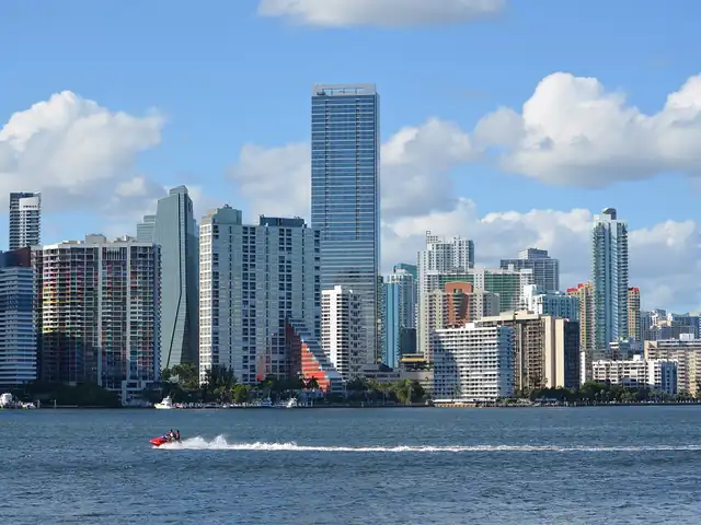 Brickell skyline in Miami seen from the Rickenbacker Causeway. Flights from Miami to Detroit
