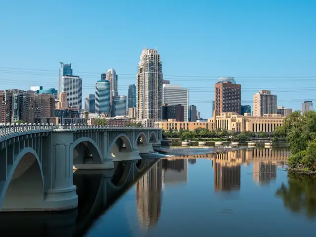 Downtown Minneapolis skyline across the Mississippi River and Third Avenue Bridge